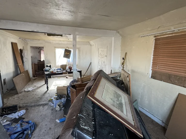 Interior with broken furniture and debris on the floor