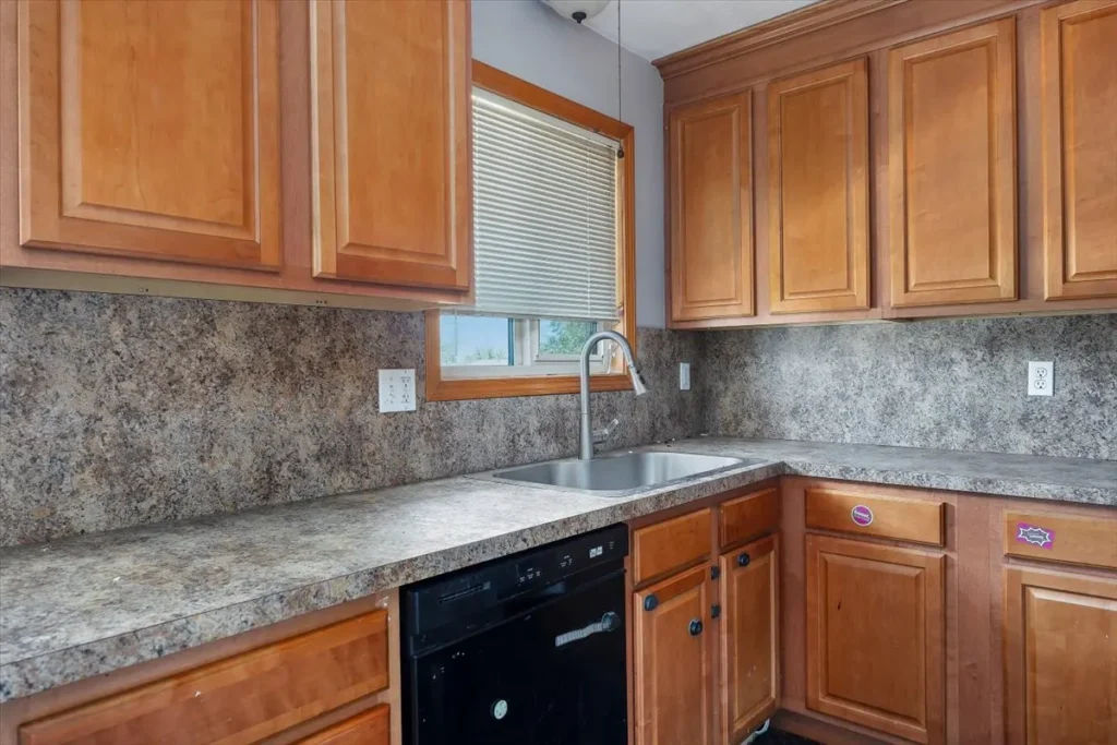 Kitchen with wood cabinets and a tile backsplash