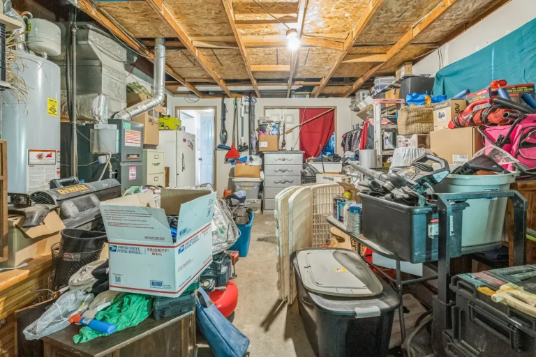 Unfinished garage packed with stored items