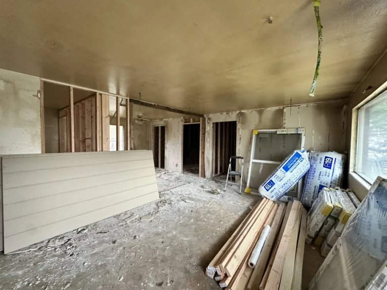 Interior mid-remodel with new framing and drywall stacked