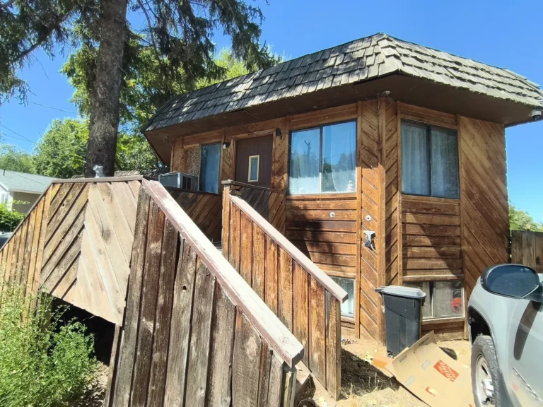 Two-story wood house with exterior stairs